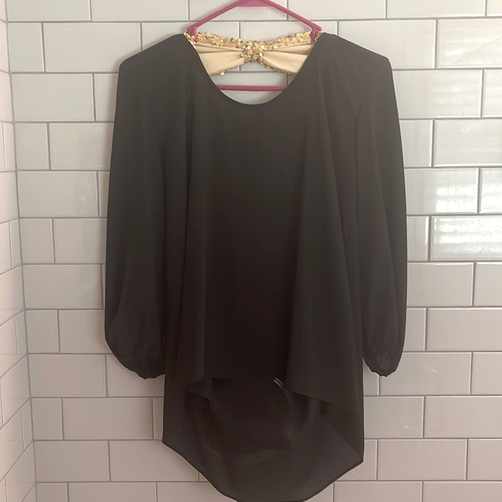 ing brand (Dillard’s I think) Sheerish black dress shirt with gold sequin bow.